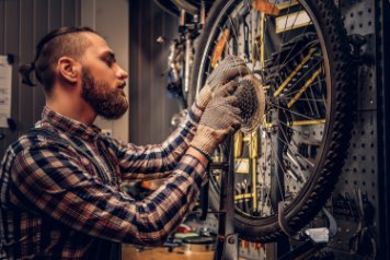 person servicing a bike in Miami